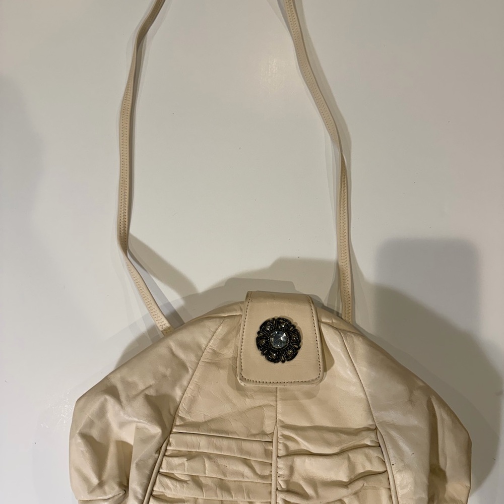 Vintage Cream Shoulder Bag with Decorative Medallion